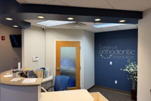 Front desk and logo wall at the Montgomery office